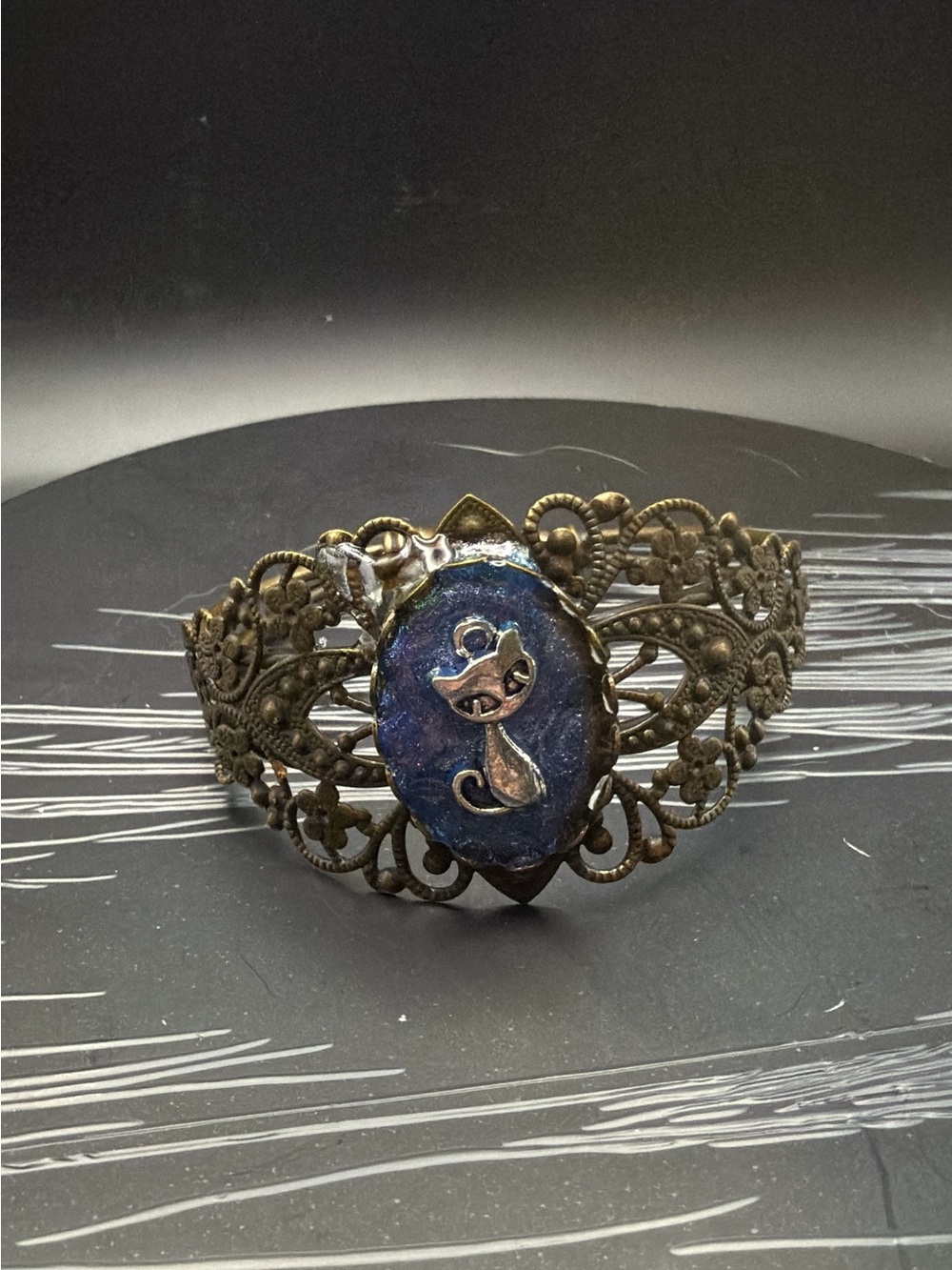 Antique Bronze Filigree Bracelet with Blue Cat Cameo Accent